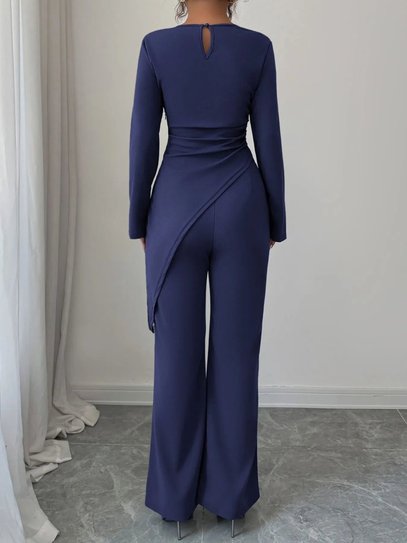 Asymmetric long sleeve top and pants set by Trendsi, featuring modern design and stylish fit in a coordinated outfit.