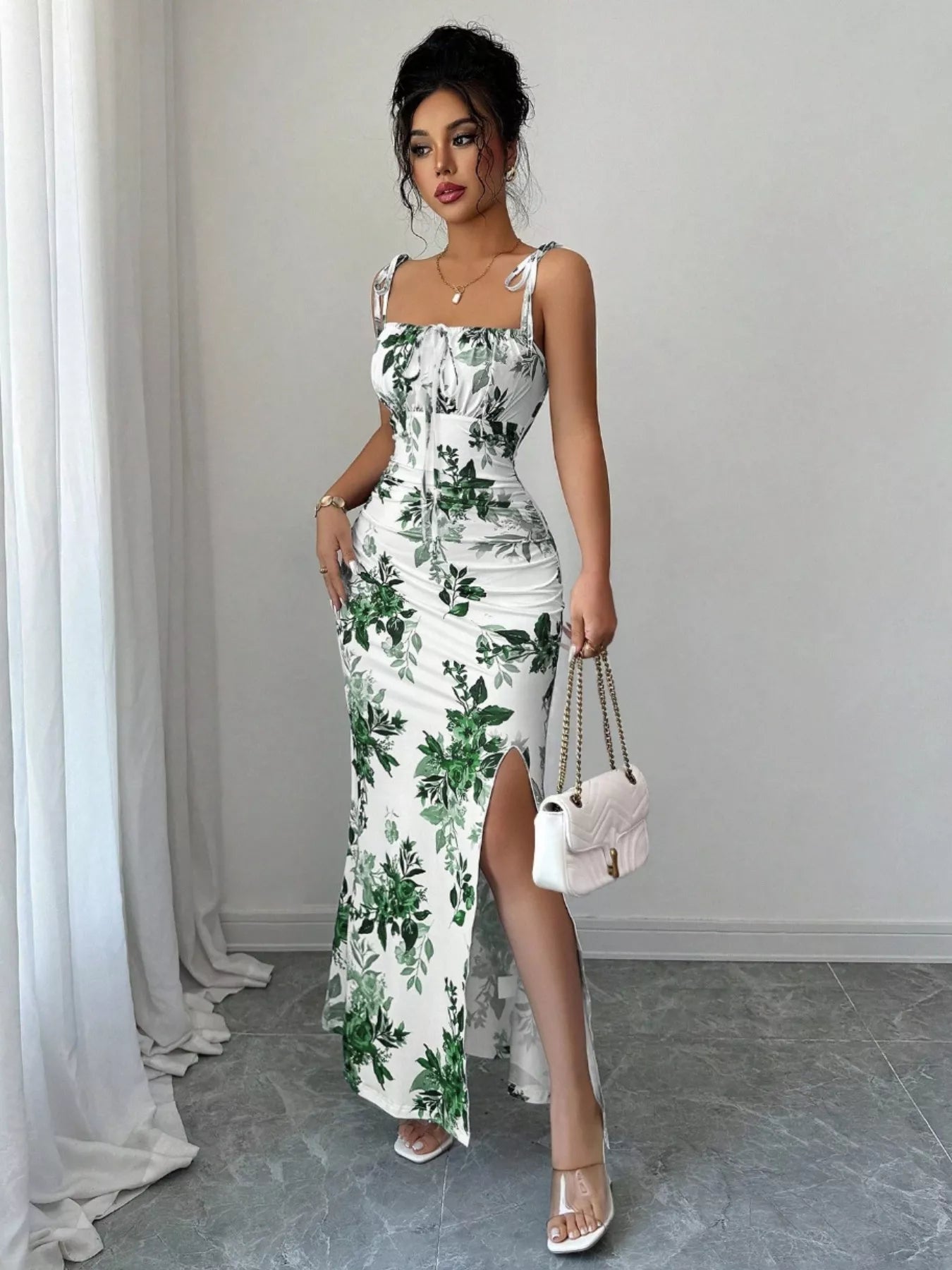 Printed tie strap slit maxi dress by Trendsi featuring a flowy design, adjustable straps, and a high slit for a stylish look.