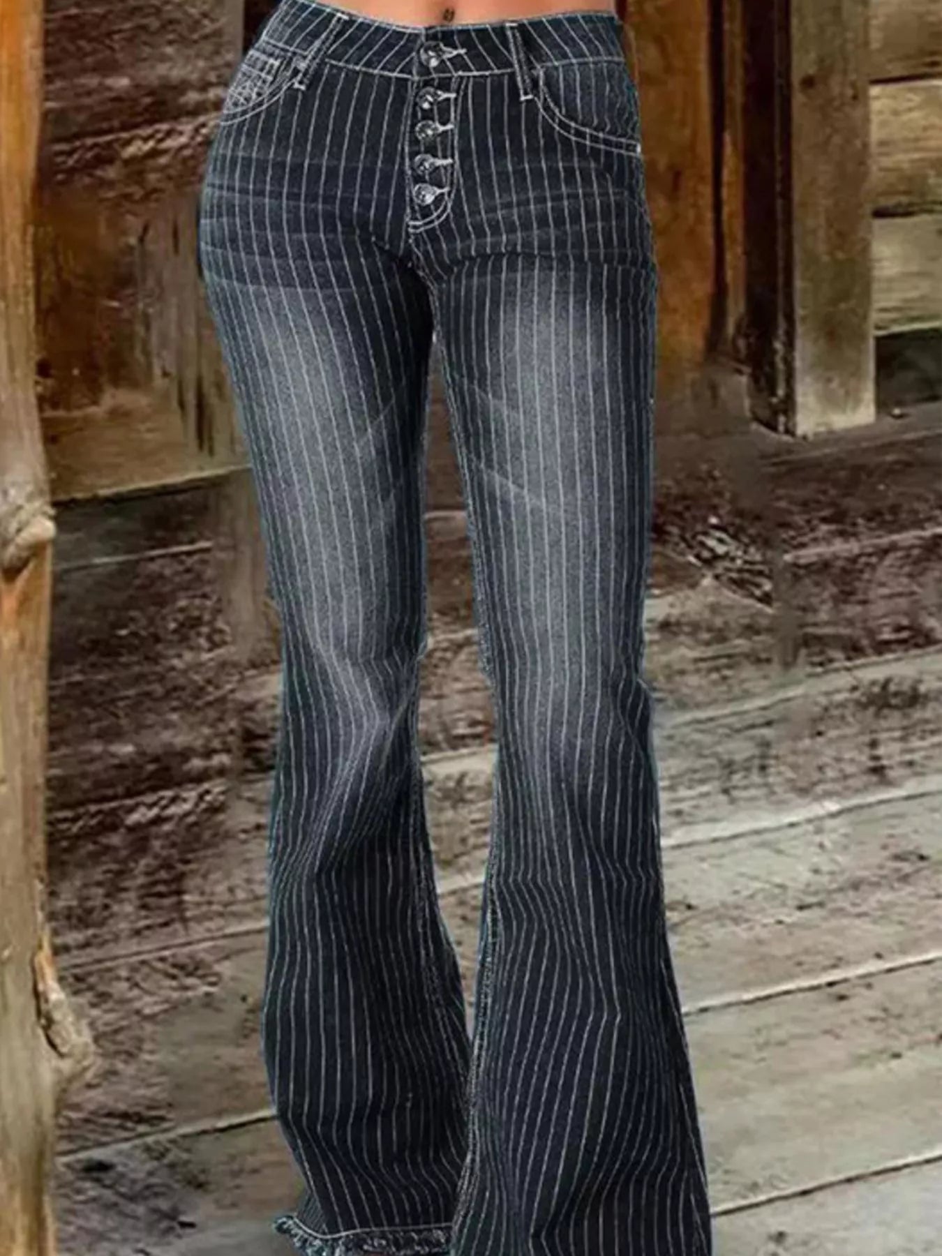 Striped button fly flare denim jeans from Trendsi, showcasing high-waisted design with bold vertical stripe pattern and classic denim texture.