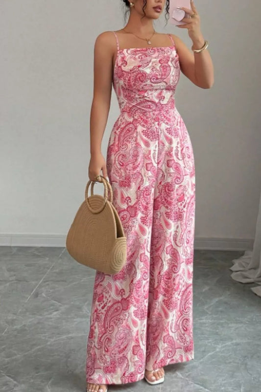 Pink paisley wide-leg jumpsuit by Trendsi featuring a flowy fit, sleeveless design, and vibrant pattern perfect for casual wear.
