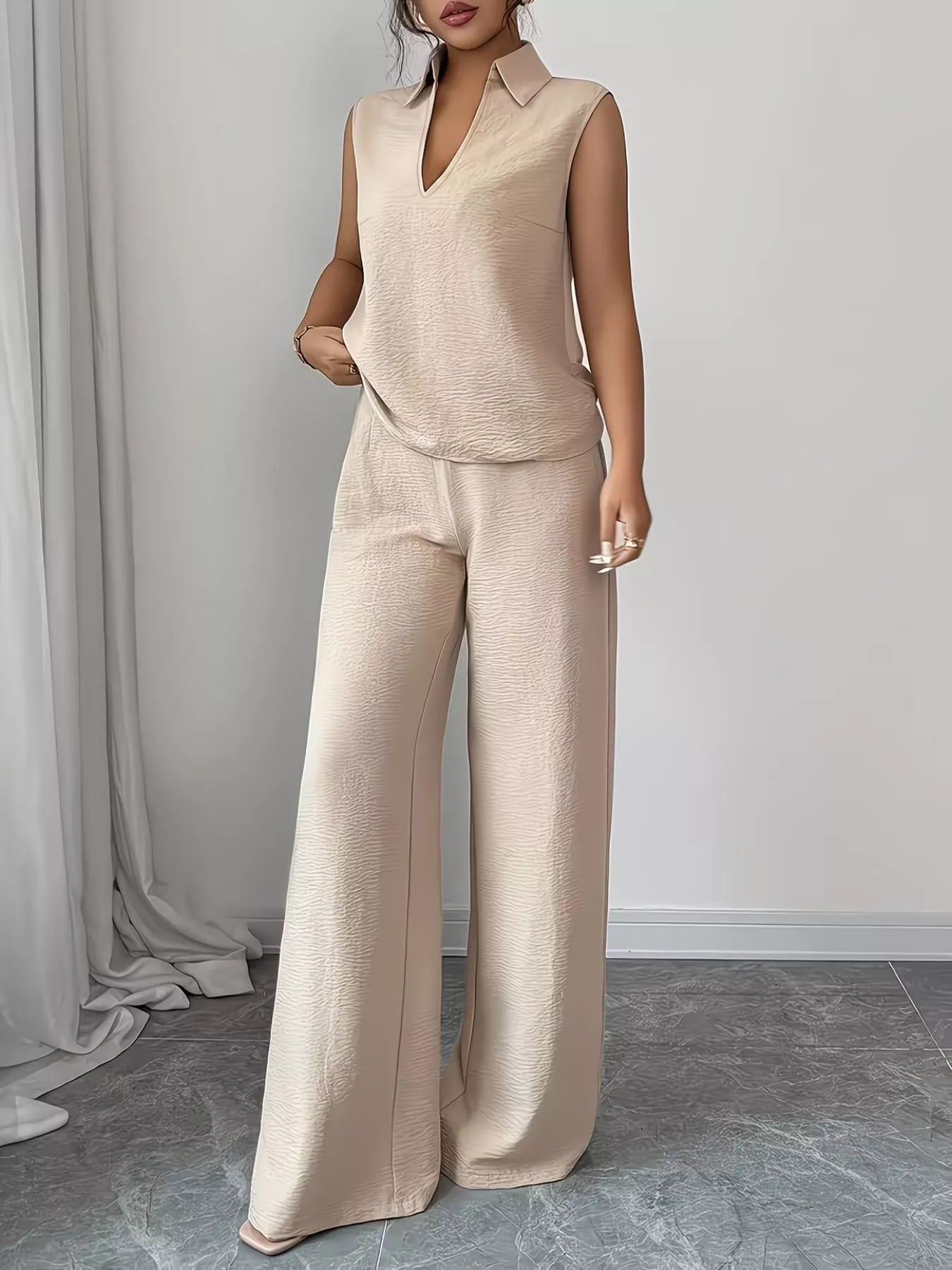 V-neck sleeveless top and wide-leg pants set from Trendsi, featuring a stylish, coordinated outfit with a relaxed fit and comfortable fabric.