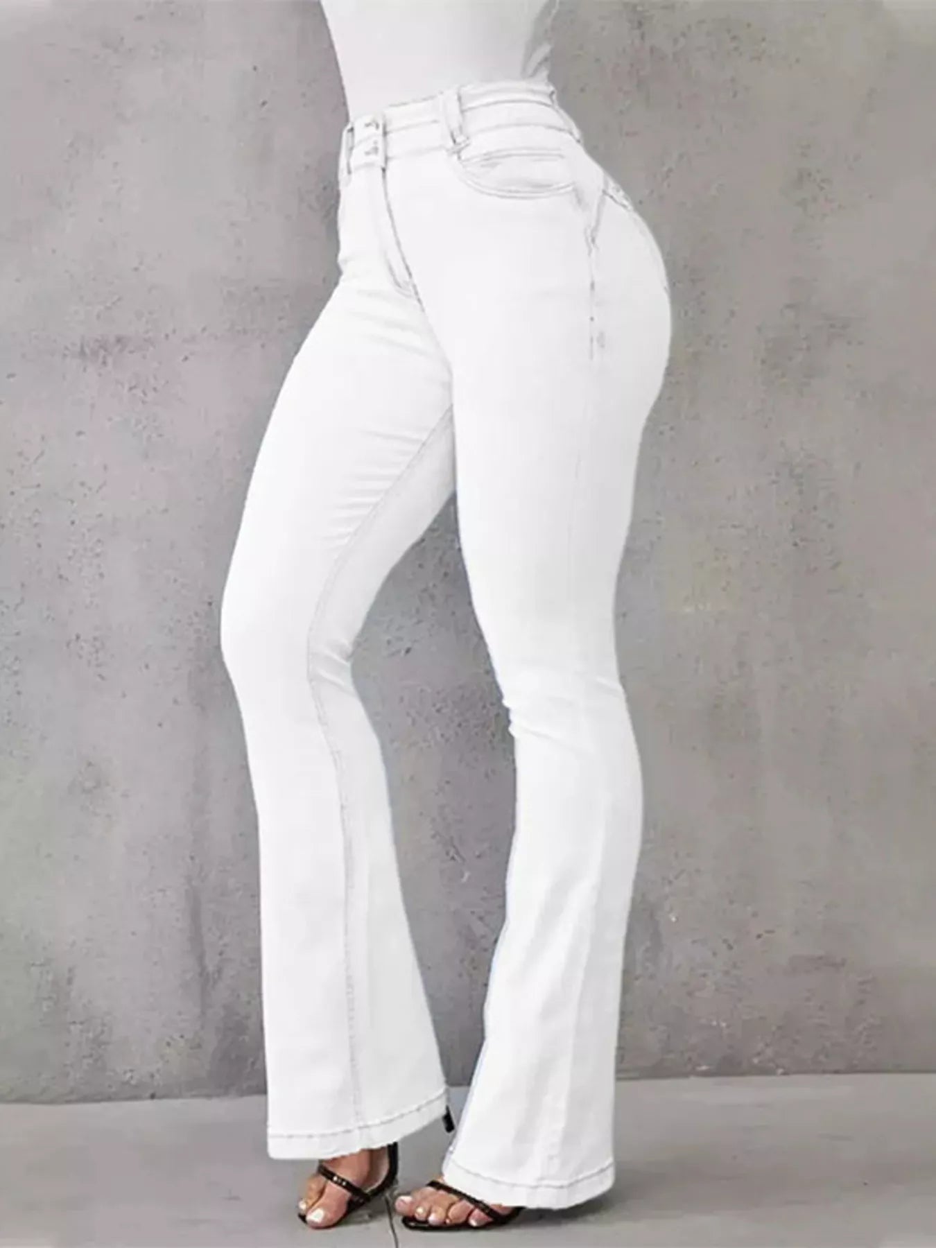 High-waisted flare jeans from Trendsi featuring a classic denim wash and stylish wide-leg bottom for a trendy look.