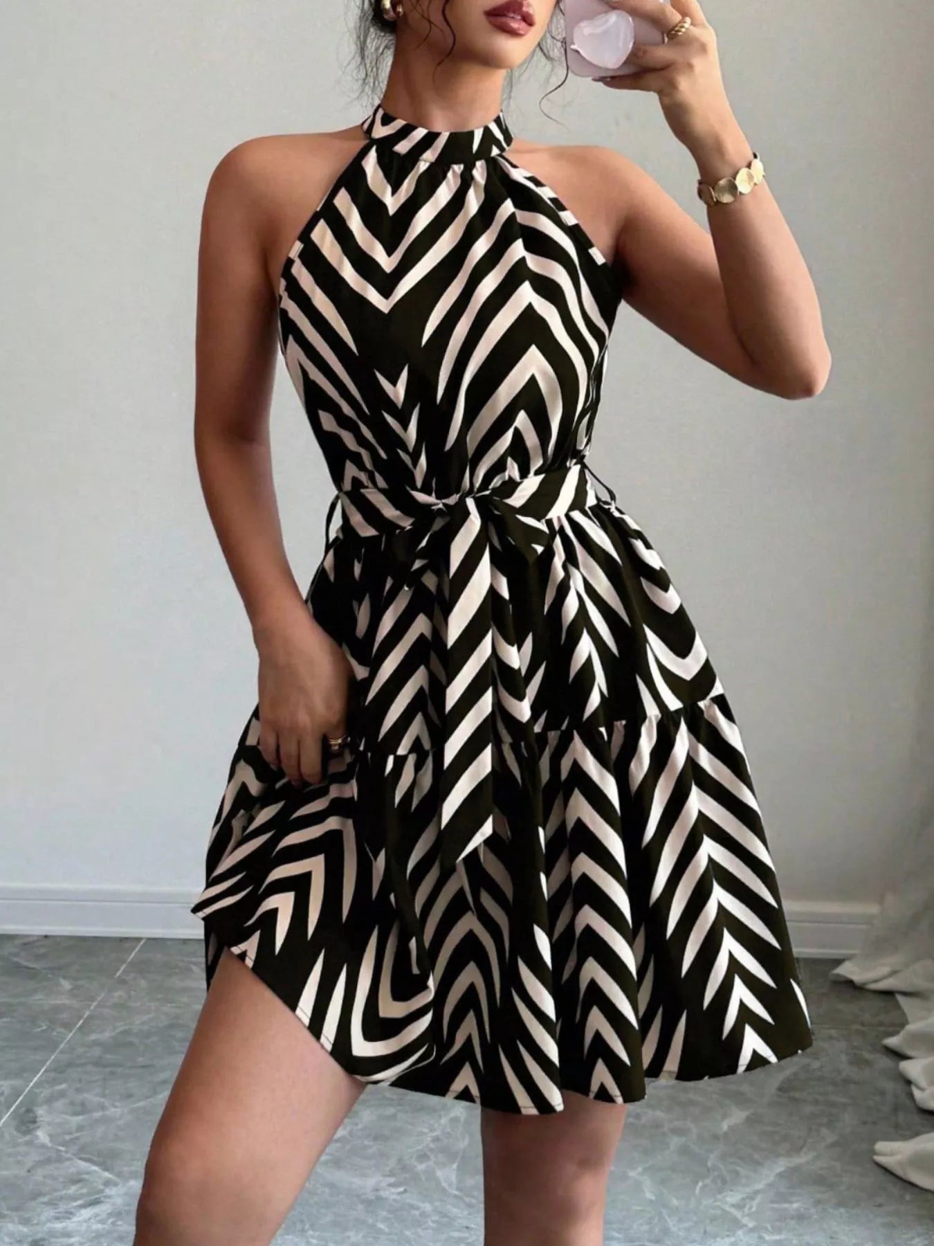 Zebra print halter neck tie waist dress with ruffle hem, stylish and feminine fashion from Trendsi.