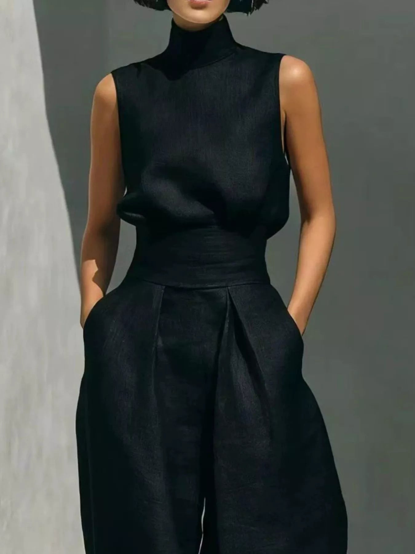 Trendsi high neck sleeveless top and wide leg pants set, stylish 2-piece outfit with a sleek design and comfortable fit.