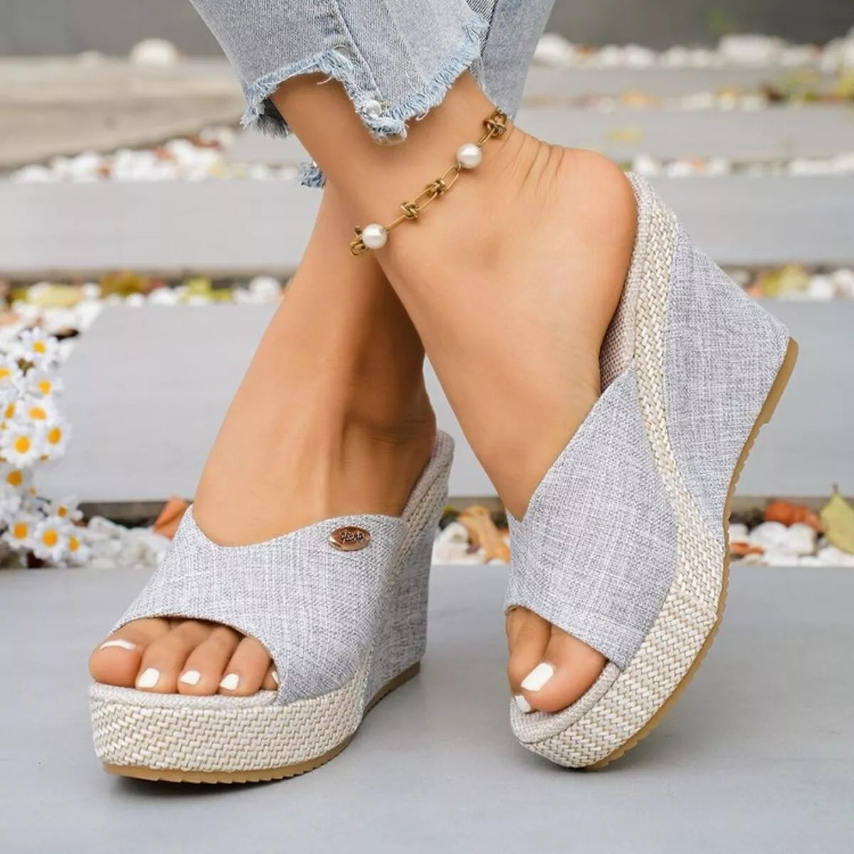 Open toe wedge sandals by Trendsi featuring a stylish design with a comfortable heel and ankle strap, perfect for warm-weather wear.